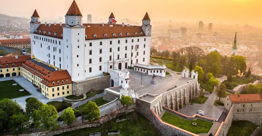 From Vienna: Bratislava with Local Guide, Castle & UFO Views - Getting there: minivan pickup, border crossing, and timing that works