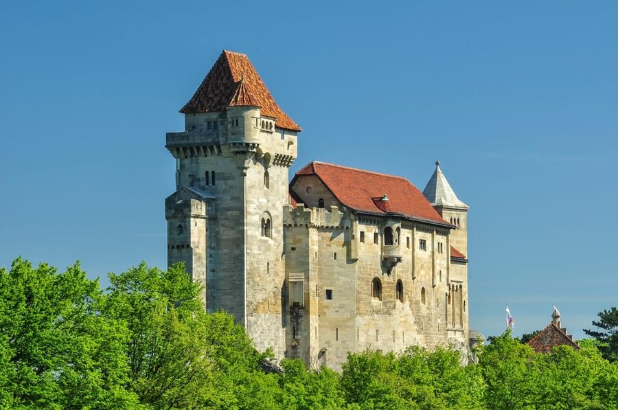 Vienna: Vienna Woods Tour with Underground Lake and Wine - Outside Lichtenstein Castle, and the Story That Comes With It